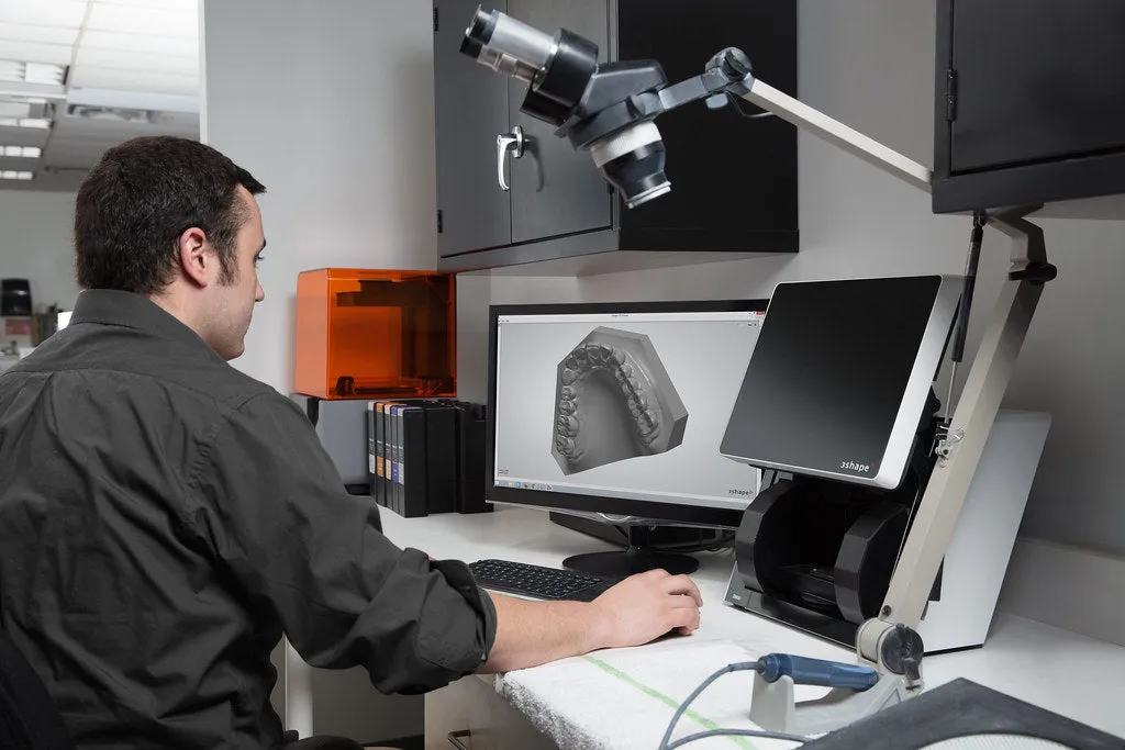 A technician scanning a model
