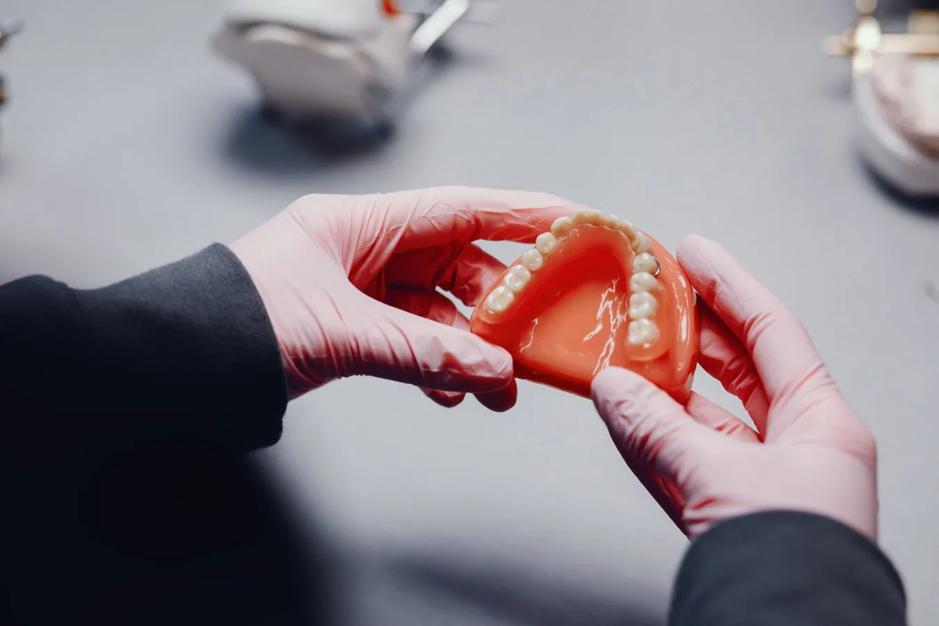 Checking a finished denture in the lab